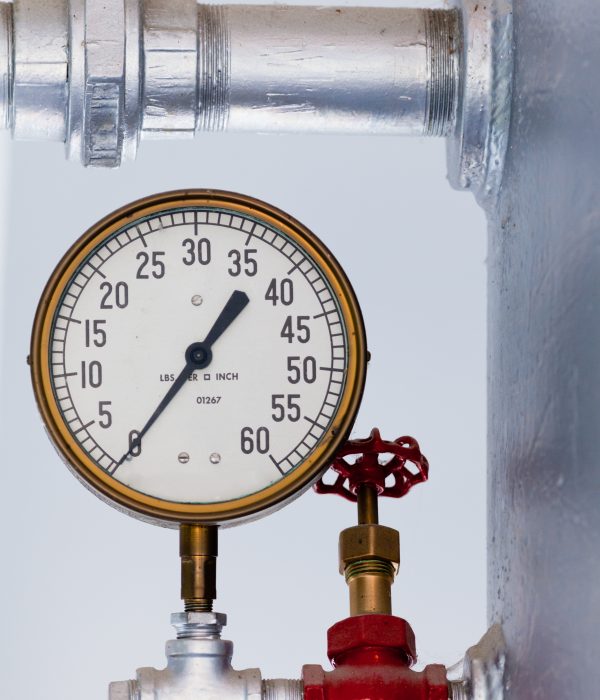 Steampunk metal pressure gauge on boiler tank